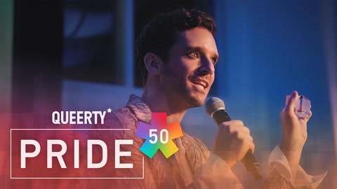 Michael Urie accepts the Catalyst award at the 2023 Queerty Pride50.