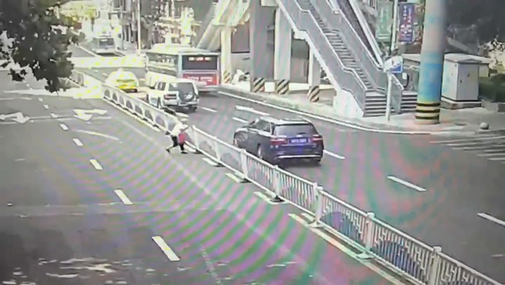 China: Elderly woman pulls down traffic barriers to take a shortcut