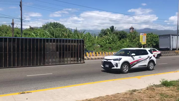 Loaded container snaps loose from trailer on Marcus Garvey Drive