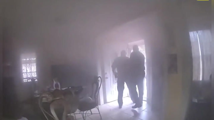Elderly man trapped in smoke-filled home rescued by police officers