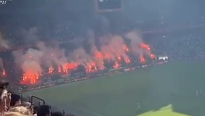 Furious fans throw flares onto pitch as Ajax's clash with Feyenoord abandoned