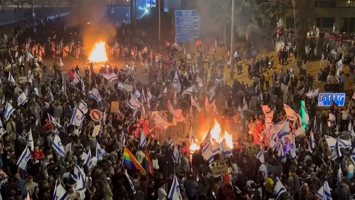 Israeli protesters light fire and block highway as Netanyahu sacks minister