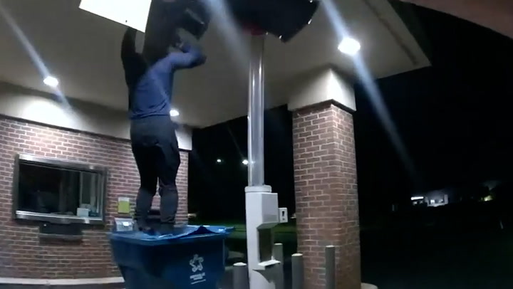Moment Suspected Burglar Falls From Ceiling Hatch Into Recycling Bin 