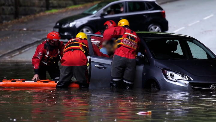 Trapped driver rescued from car as flash flooding hits Liverpool