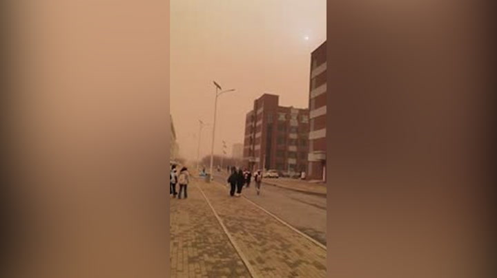 China: Surroundings Take On Brownish Orange Hue As Sandstorm Shrouds Changchun City In Jilin