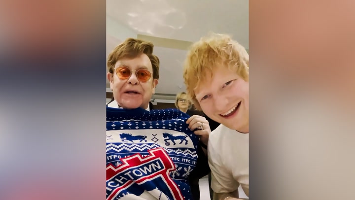 Ed Sheeran and Elton John swap Christmas presents as they watch Watford vs Ipswich match