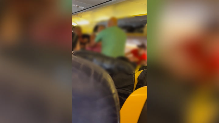 Moment 'drunk' woman gets into fight on Ryanair flight to Ibiza