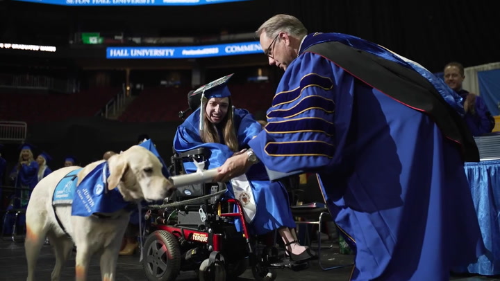 Service dog 'graduates' alongside owner at New Jersey university