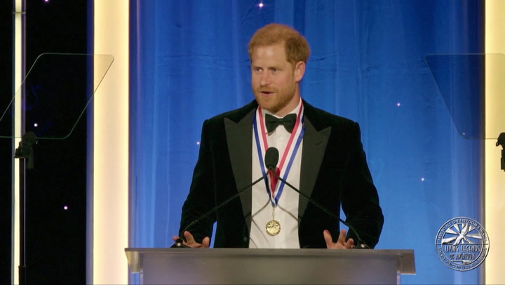 Prince Harry Receives Award for Helicopter Pilot Skills From John Travolta