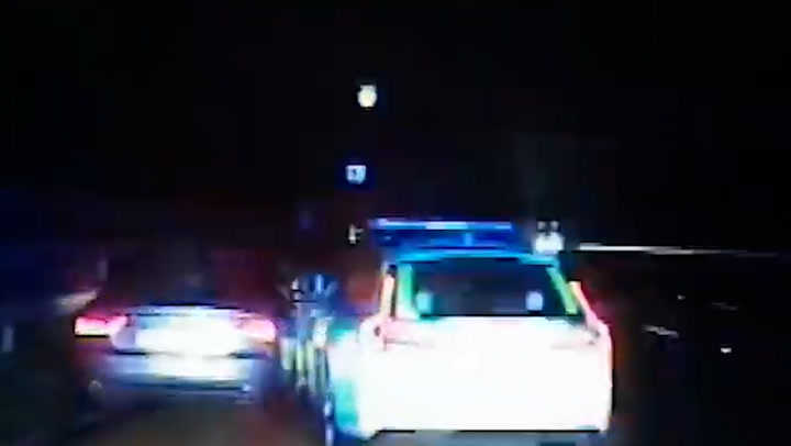 Moment disqualified and armed driver rams police car before 135mph motorway chase