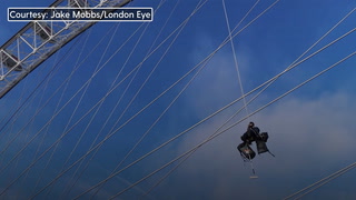 Crew scale London Eye and use 5,000 litres of paint in spring clean