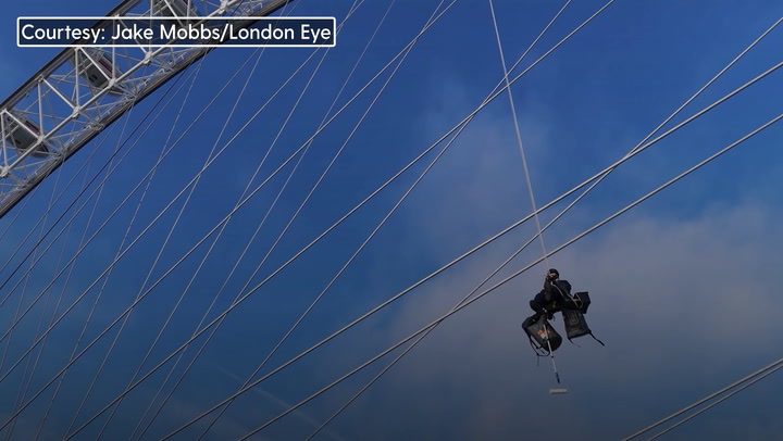 Workers use 5,000 litres of paint and scale 135-metre-tall London Eye for spring clean