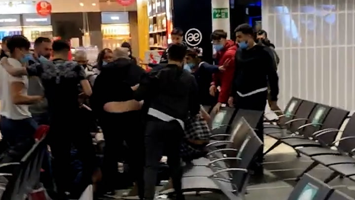 Shocking footage of a mass brawl at Luton airport that saw 17 people arrested