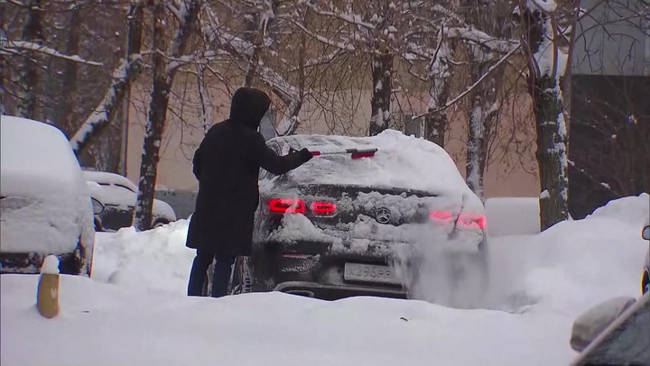 Moscow blanketed in thick carpet of snow as temperatures in far east region drop to -50C