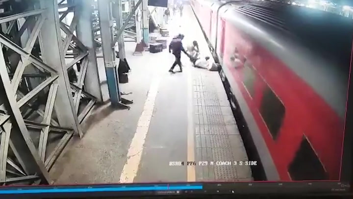 Man dragged along platform after falling from moving train