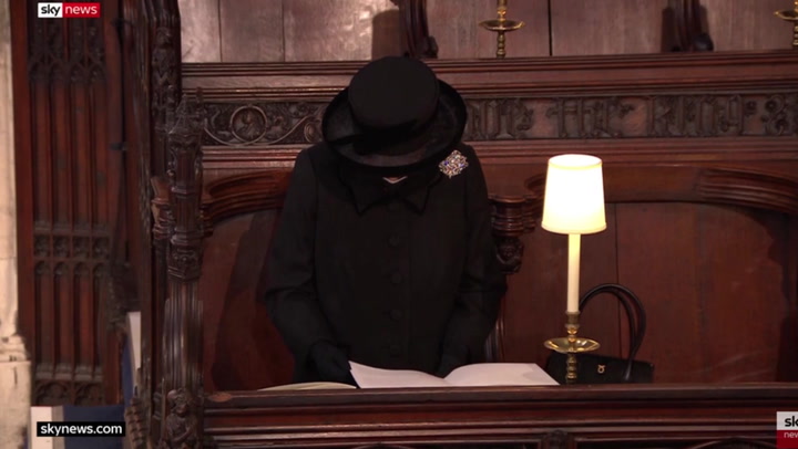 Queen bows head as funeral service begins