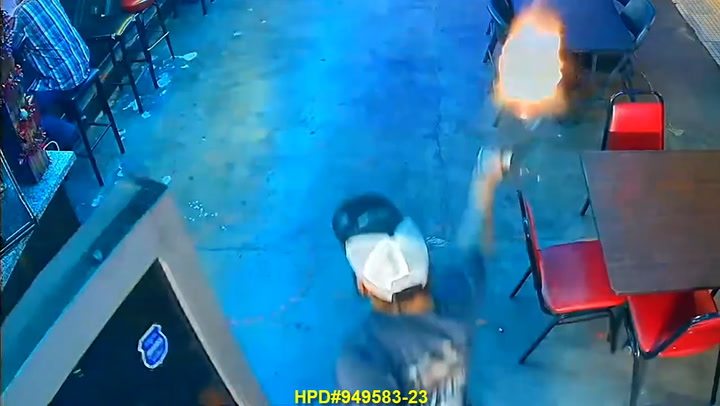 Moment armed robber fires handgun in crowded Houston bar