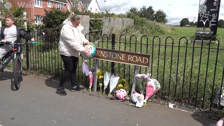 Tributes at scene where seven-year-old girl killed in hit and run as boy, 14, arrested