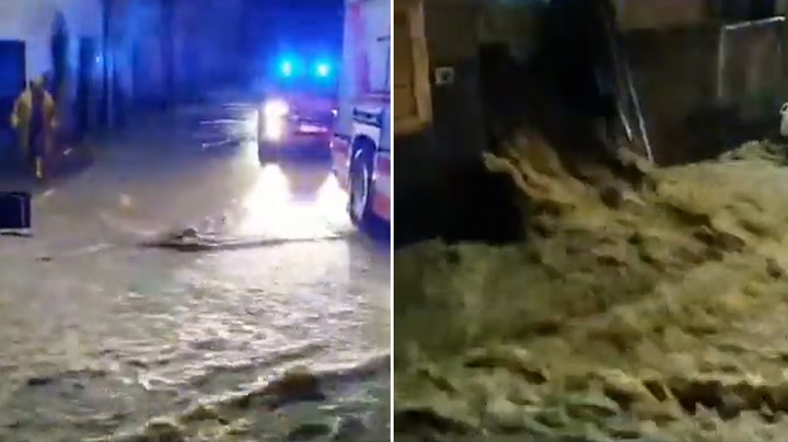 Torrent of water rushes down road as Tuscany hit by heavy floods