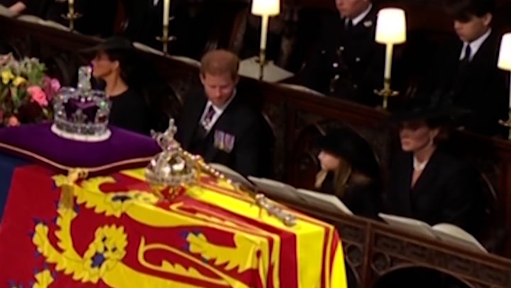 Prince Harry smiles at Princess Charlotte during Queen Elizabeth II's funeral