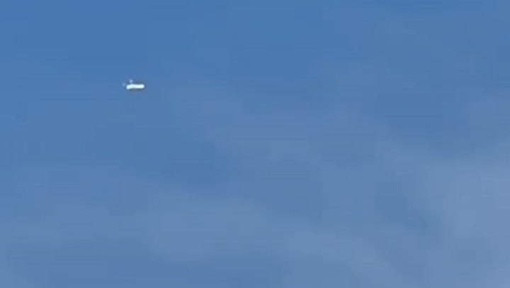 'Tic-tac UFO' with 'attachment at back' spotted hovering above city in ...