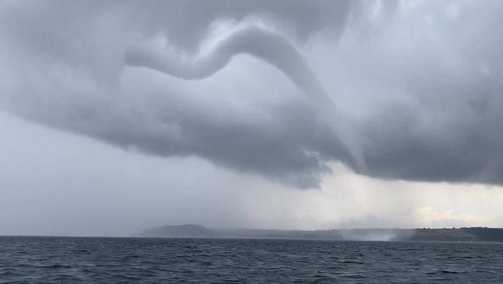 Waterspout appears over sea as storms hit Cornwall coast