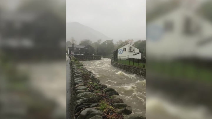 Cumbria river rises following torrential rain and flooding