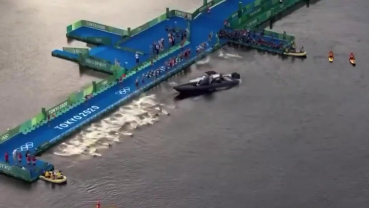 Boat blocks the competitors at start of Olympic triathlon
