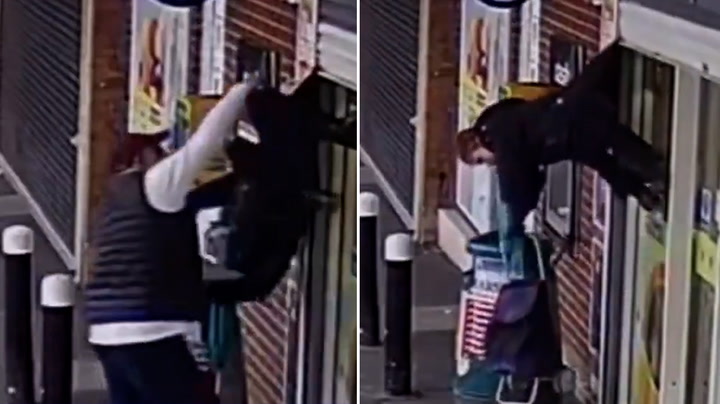 Woman saved after shop shutter lifts her into air