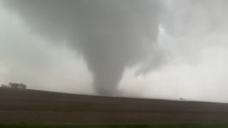 Watch: Storm chasers drive through tornado tearing across rural Iowa