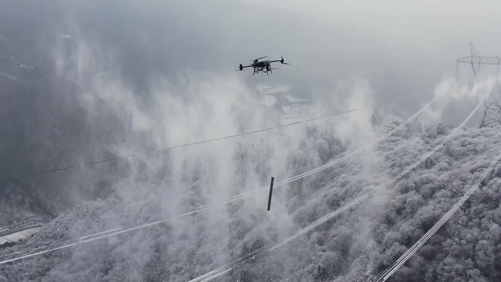 Drone used to smash ice off power lines in China's Sichuan