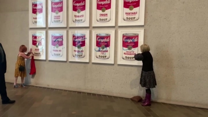 Climate protesters glue hands to Andy Warhol artwork in Australia
