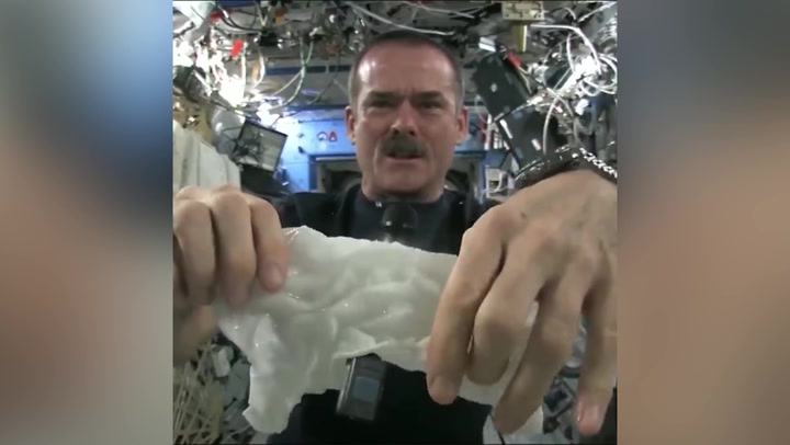 Astronaut shows what happens when you wring out a wet towel while floating in space