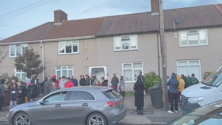 Dozens of people view down street to view two-bedroom house in East London