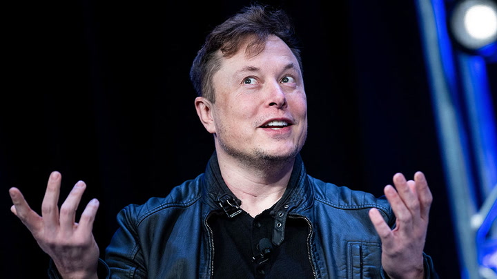 Elon Musk says Twitter deal ‘temporarily on hold’ over spam and fake accounts