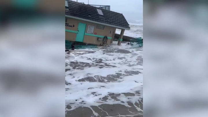 Storm Nicole: Building submerged in water after collapsing into ocean