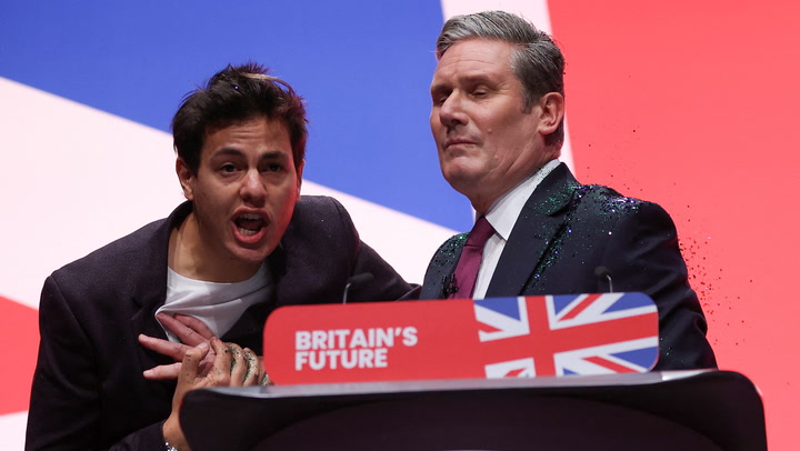 Keir Starmer showered in glitter by stage intruder during Labour conference speech