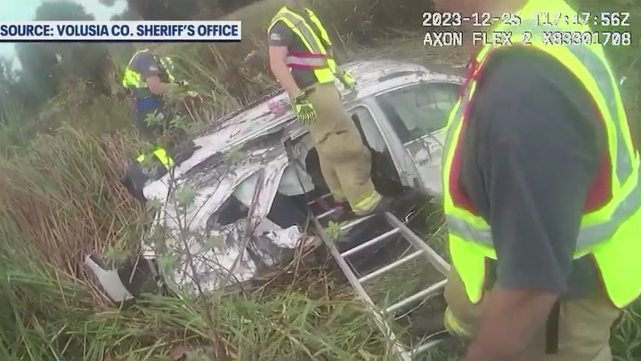 First responders form human chain to pull Christmas presents from crashed car