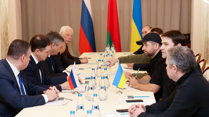 Ukraine and Russia begin peace talks at Belarus border as fierce fighting continues