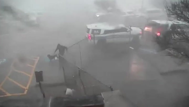 Moment officer rescues police dog from car before tornado strikes Texas city