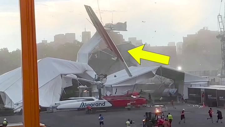 WINDS TOSS THIS HUGE SAIL FROM TEAM CANADA SPARKING PANIC