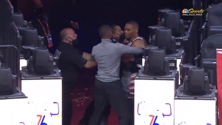 They throw popcorn at Westbrook and have to hold him down