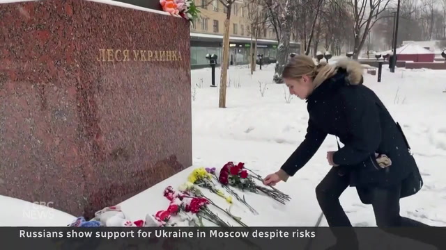 Russians lay flowers as anti-war protest