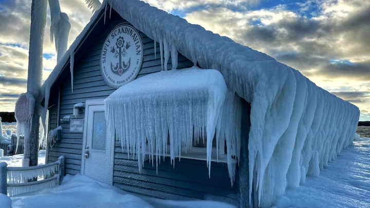 Wisconsin shop covered in ice as blizzard ravages US