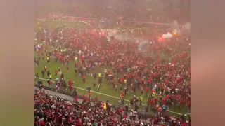 Moment Bayer Leverkusen fans storm pitch as club win Bundesliga title