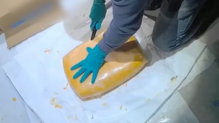 Moment police find cocaine stuffed inside cheese in £17.2m haul