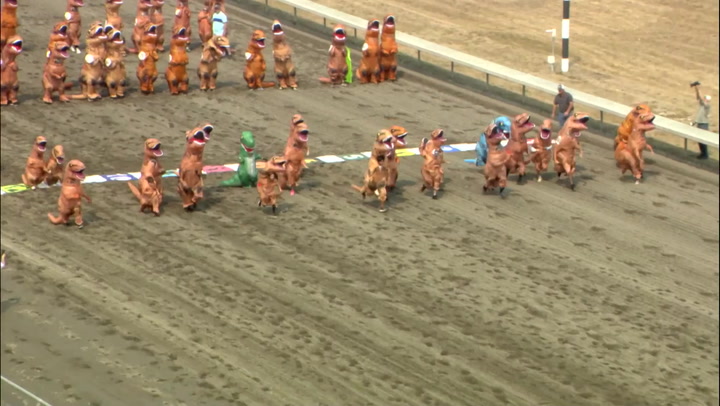 Hundreds of T-Rexes compete in children's dinosaur race