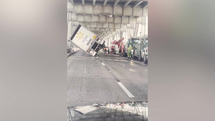 Authorities pull Walmart lorry upright after strong winds topple vehicle