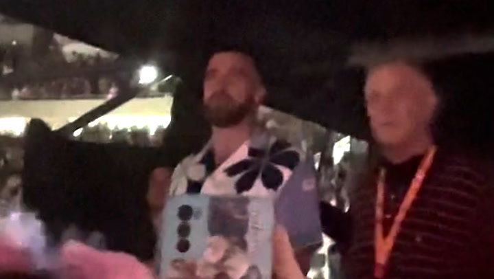 Travis Kelce and Taylor Swift's father dance side-by-side at Argentina concert