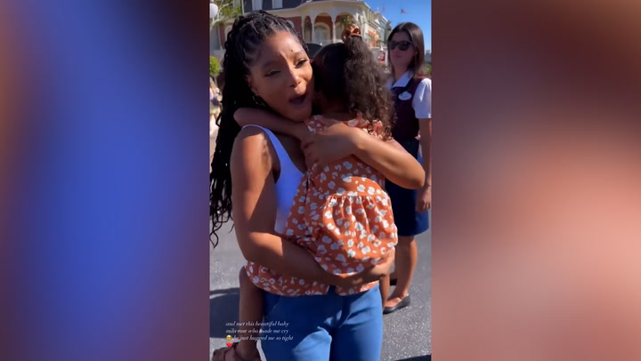 Little girl refuses to let go of Halle Bailey as they meet at Disney World